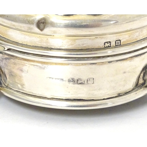 361 - A silver ring box of circular form on three outswept feet. Hallmarked Birmingham 1911. Approx. 2 1/2... 