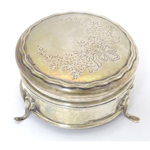 361 - A silver ring box of circular form on three outswept feet. Hallmarked Birmingham 1911. Approx. 2 1/2... 