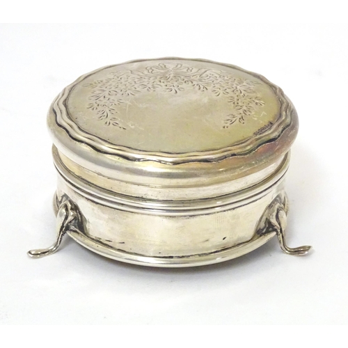 361 - A silver ring box of circular form on three outswept feet. Hallmarked Birmingham 1911. Approx. 2 1/2... 