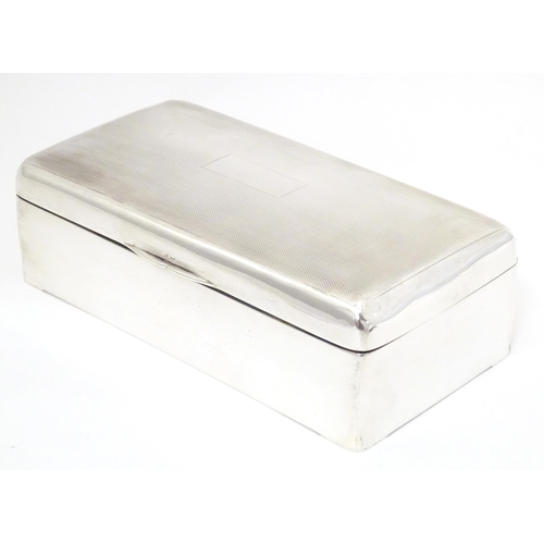 367 - A silver cigarette box of rectangular form, hallmarked Birmingham 1931, maker Wilmot Manufacturing C... 