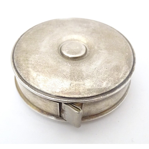 370 - A Continental silver cased tape measure Approx. 2