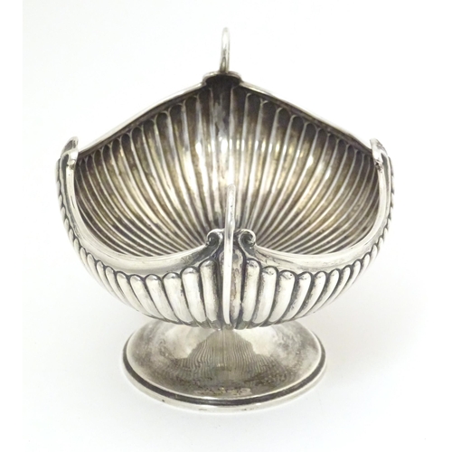 376 - A late 19th / early 20thC silver bowl of fluted oval form with twin handles. Indistinctly signed Bir... 