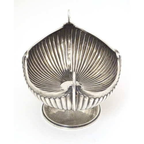 376 - A late 19th / early 20thC silver bowl of fluted oval form with twin handles. Indistinctly signed Bir... 