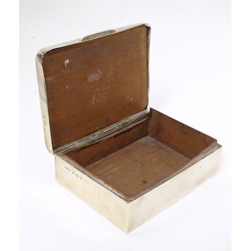 290 - A silver cigarette box with wooden lining. Hallmarked Birmingham 1963 maker W T Toghill & Co. Approx... 