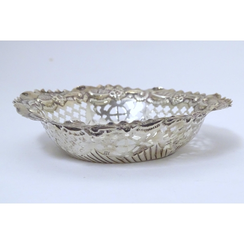 294 - A Victorian silver bon bon dish of circular form with embossed and pierced decoration, hallmarked Ch... 