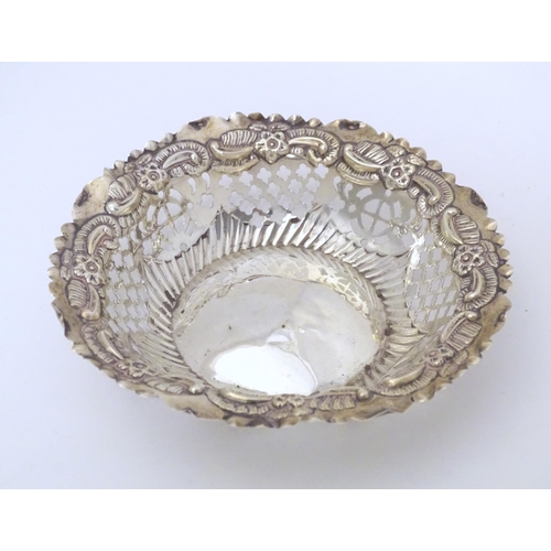 294 - A Victorian silver bon bon dish of circular form with embossed and pierced decoration, hallmarked Ch... 