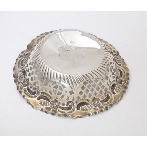 294 - A Victorian silver bon bon dish of circular form with embossed and pierced decoration, hallmarked Ch... 