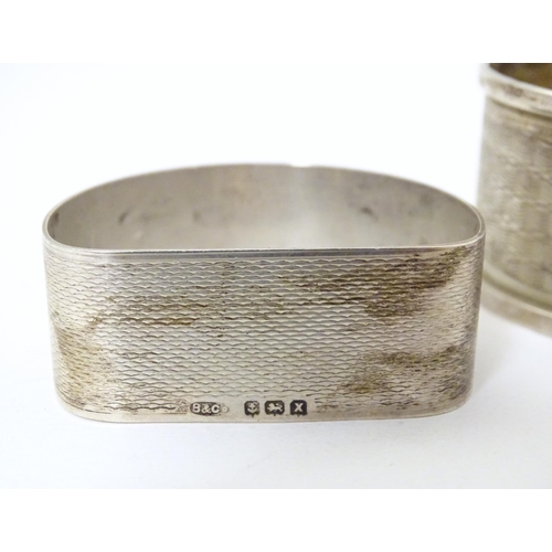 295 - Two silver napkin rings, one hallmarked Birmingham 1947, maker B & Co., the other hallmarked Chester... 