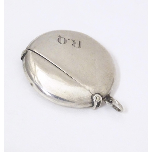 297 - A silver vesta case of circular form, hallmarked Birmingham 1914, maker William Neale & Son Ltd. App... 