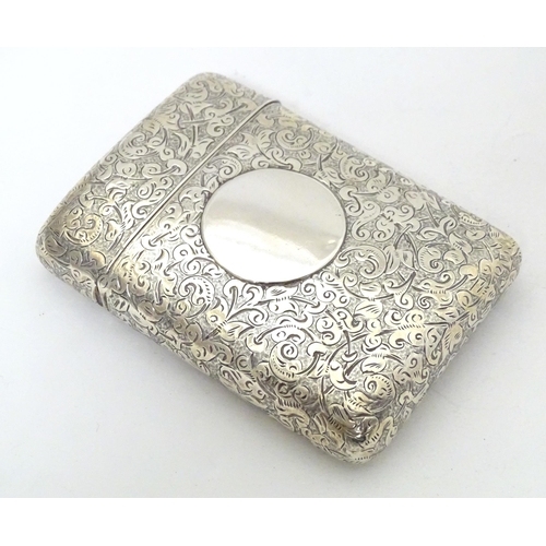 299 - A Victorian silver cigarette case of shaped form with engraved acanthus scroll decoration hallmarked... 