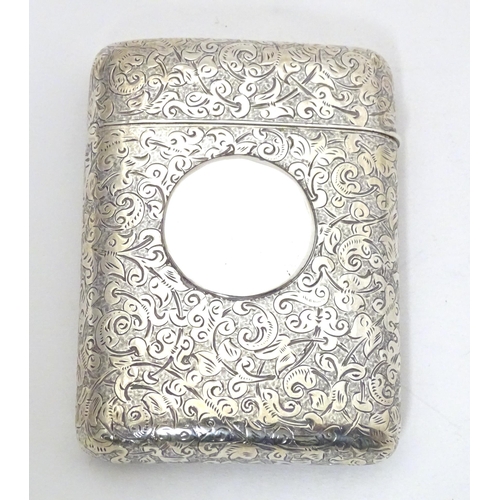 299 - A Victorian silver cigarette case of shaped form with engraved acanthus scroll decoration hallmarked... 