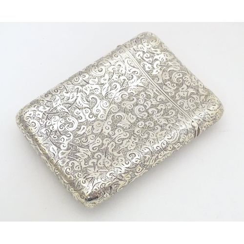 299 - A Victorian silver cigarette case of shaped form with engraved acanthus scroll decoration hallmarked... 