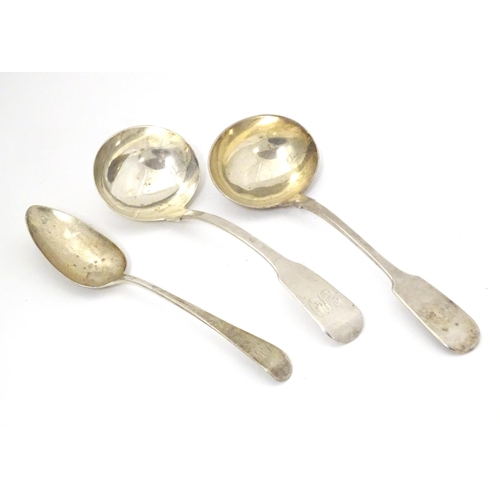 301 - Two silver fiddle pattern sauce ladles, together with an Old English pattern dessert spoon. The ladl... 