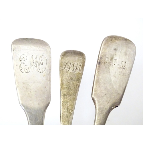 301 - Two silver fiddle pattern sauce ladles, together with an Old English pattern dessert spoon. The ladl... 