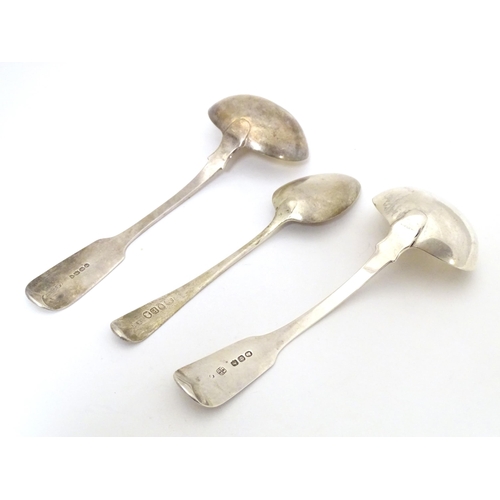 301 - Two silver fiddle pattern sauce ladles, together with an Old English pattern dessert spoon. The ladl... 