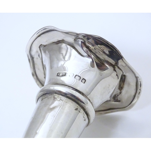 302 - A silver bud vase with flared rim hallmarked Birmingham 1904. Approx. 5 1/2