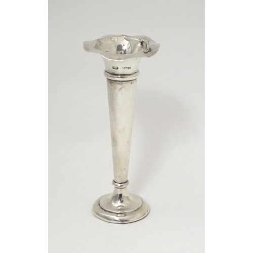 302 - A silver bud vase with flared rim hallmarked Birmingham 1904. Approx. 5 1/2