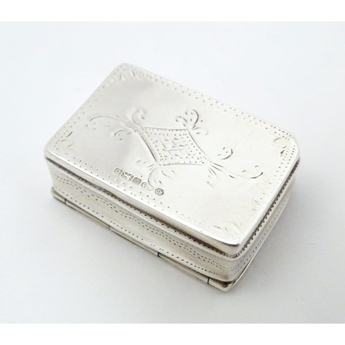 305 - A silver pill box with engraved decoration, hallmarked Sheffield 2002, maker Carrs of Sheffield Ltd.... 