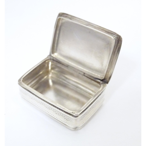 305 - A silver pill box with engraved decoration, hallmarked Sheffield 2002, maker Carrs of Sheffield Ltd.... 