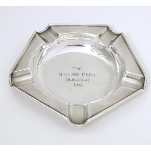 308 - An Art Deco silver ashtray engraved to centre The Grange Park (Builders Ltd.) hallmarked London 1945... 