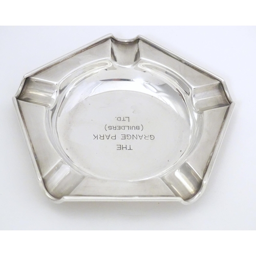 308 - An Art Deco silver ashtray engraved to centre The Grange Park (Builders Ltd.) hallmarked London 1945... 