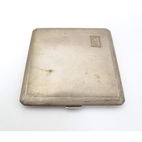 309 - A silver cigarette case with engine turned decoration and gilded interior, hallmarked Birmingham 196... 