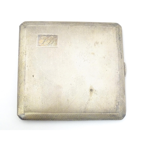 309 - A silver cigarette case with engine turned decoration and gilded interior, hallmarked Birmingham 196... 