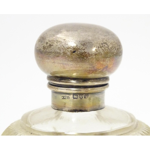 430 - A cut glass scent bottle of spherical form with silver top hallmarked Chester 1921, maker William Va... 