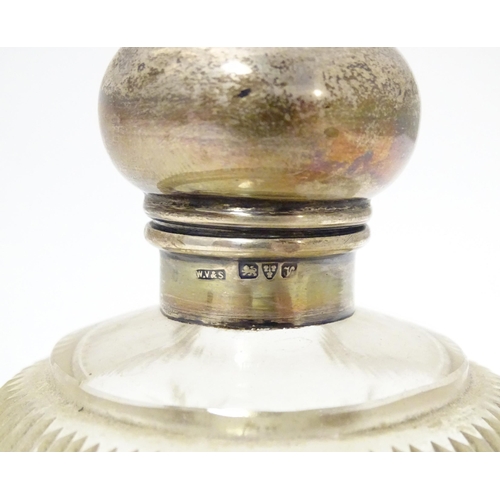 430 - A cut glass scent bottle of spherical form with silver top hallmarked Chester 1921, maker William Va... 