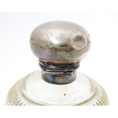 430 - A cut glass scent bottle of spherical form with silver top hallmarked Chester 1921, maker William Va... 