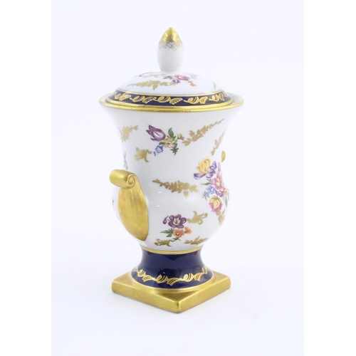 104 - A 20thC German vase and cover decorated with floral and foliate detail with gilt detail. Bearing mar... 