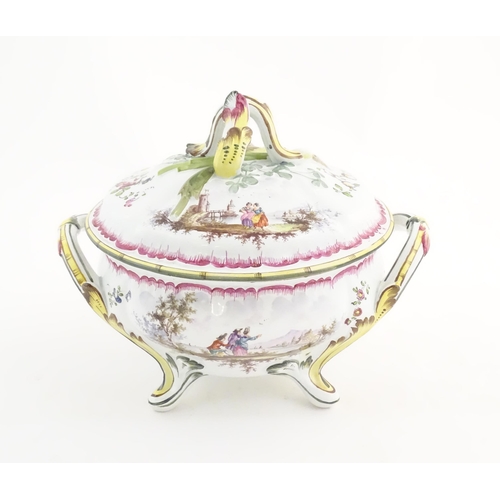 108 - A French lidded tureen with foliate formed handles and standing on four out swept feet, the lid with... 