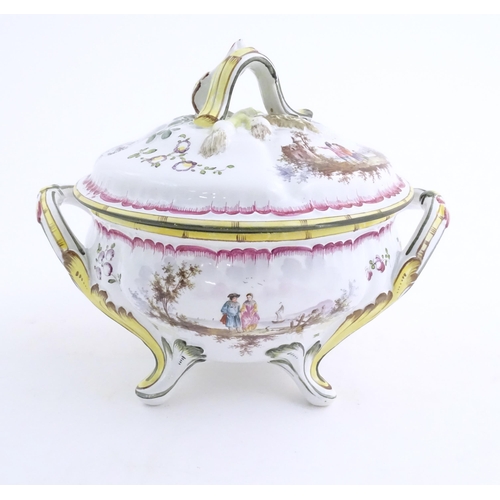 108 - A French lidded tureen with foliate formed handles and standing on four out swept feet, the lid with... 