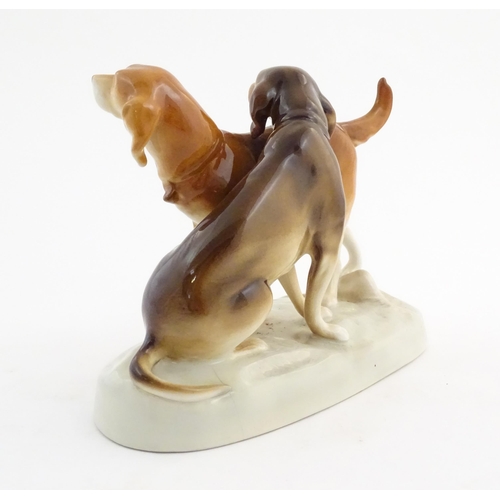 110 - A 20thC Royal Dux model of two dogs. Marked under. Approx. 7 3/4