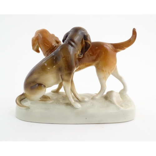 110 - A 20thC Royal Dux model of two dogs. Marked under. Approx. 7 3/4