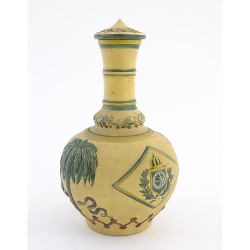 112 - A 19thC lidded bottle vase with relief and polychrome decoration depicting the coat of arms of the E... 