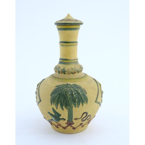 112 - A 19thC lidded bottle vase with relief and polychrome decoration depicting the coat of arms of the E... 