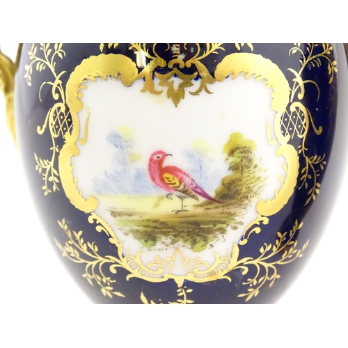 124 - Two Coalport vase and covers with twin handles decorated with hand painted exotic bird vignettes and... 