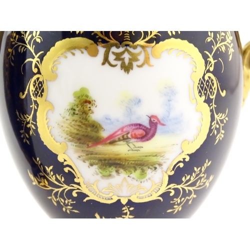 124 - Two Coalport vase and covers with twin handles decorated with hand painted exotic bird vignettes and... 