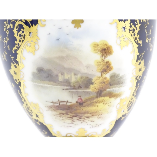 126 - A Coalport vase and cover the central vignette decorated with hand painted landscape scene signed P.... 