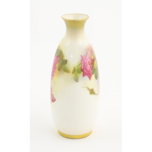 129 - A Royal Worcester vase with floral decoration. Signed Ethel Spilsbury. Marked under. Approx. 5 1/4