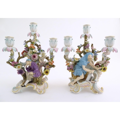 94 - A pair of late 19thC Meissen three branch figural and floral candelabras, one depicting the Greek ph... 