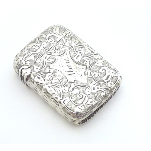 310 - A Victorian silver vesta case with engraved foliate decoration, hallmarked Birmingham 1893, maker Jo... 