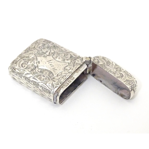 310 - A Victorian silver vesta case with engraved foliate decoration, hallmarked Birmingham 1893, maker Jo... 