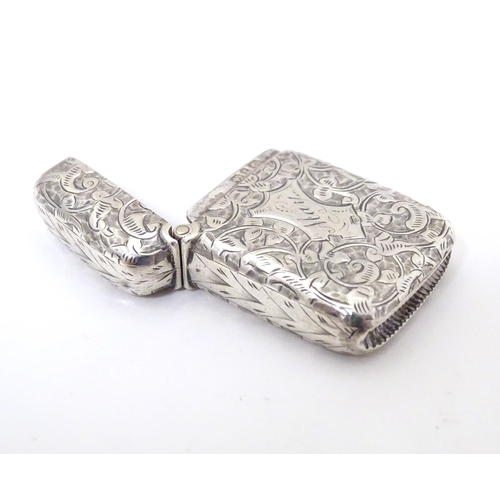 310 - A Victorian silver vesta case with engraved foliate decoration, hallmarked Birmingham 1893, maker Jo... 