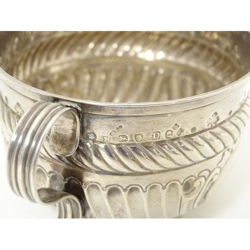 312 - WITHDRAWN FROM AUCTION - Apologies for any inconvenience. A Geo III silver porringer with fluted and... 