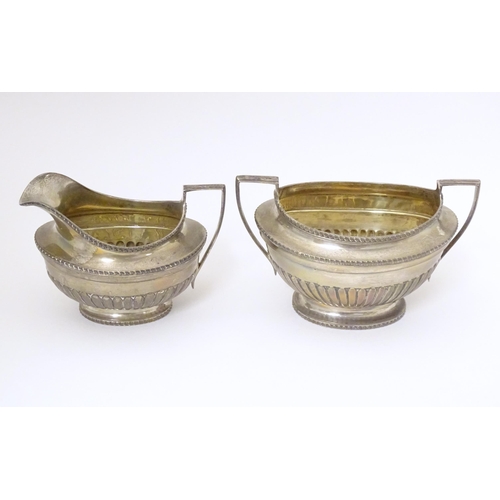 316 - A silver sugar bowl and cream jug hallmarked London 1905, maker Goldsmiths & Silversmiths Company Lt... 