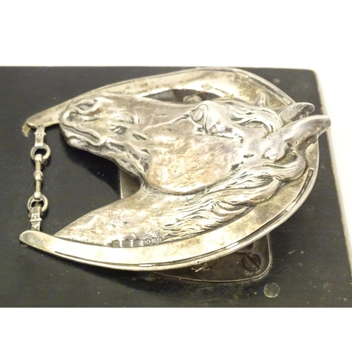 321 - A silver letter / note clip mounted on an ebonised base. The clip modelled as a horse head and horse... 