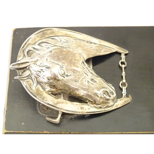 321 - A silver letter / note clip mounted on an ebonised base. The clip modelled as a horse head and horse... 