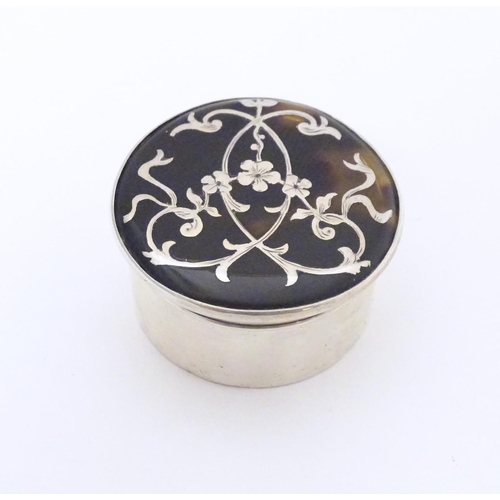 329 - A silver and tortoiseshell pill box with  pique decoration to lid. Hallmarked  London 1912 Approx. 1... 